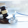 Gavel and stethoscope. medical jurisprudence. legal definition of medical malpractice. attorney. common errors doctors, nurses and hospitals make.