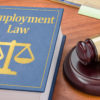 A law book with a gavel - Employment Law